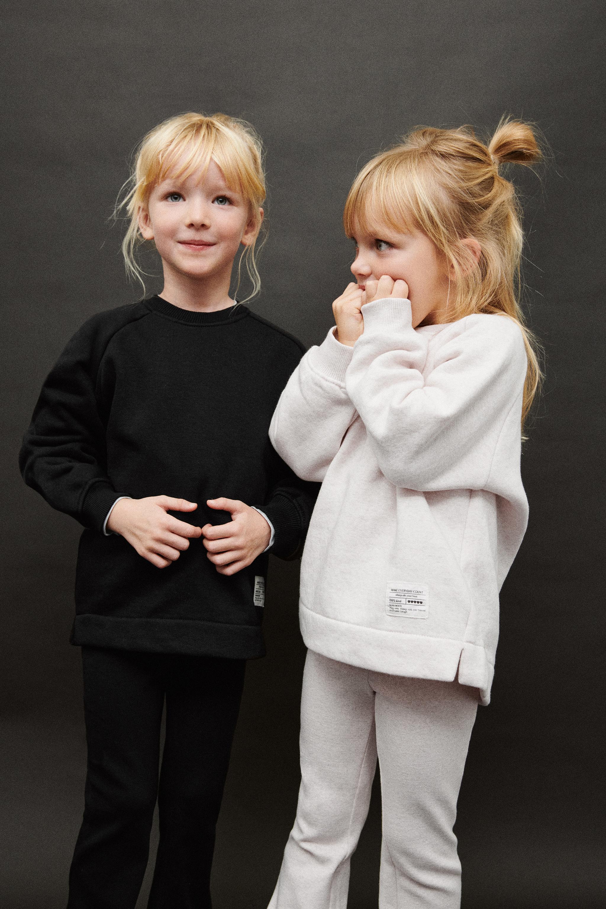 INTERLOCK FLARE LEGGINGS WITH LABEL DETAIL